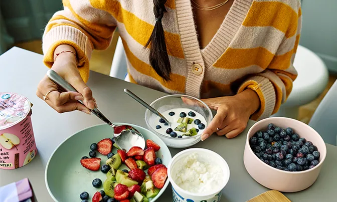 A bowl of pasta, arugula, and chickpeas.